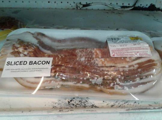 $8 moldy bacon for sale on shelf in meat dept.