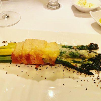 Asparagus wrapped in prosciutto and cheese