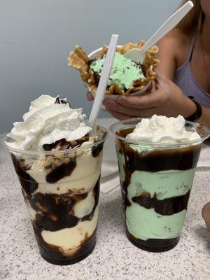 Single mint chocolate chip in a waffle bowl, mint chocolate chip with hot fudge and a banana pudding ice cream with hot fudge and peanuts.