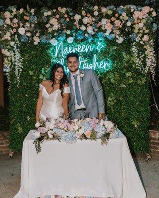 Floral backdrop rental and sweetheart table flowers