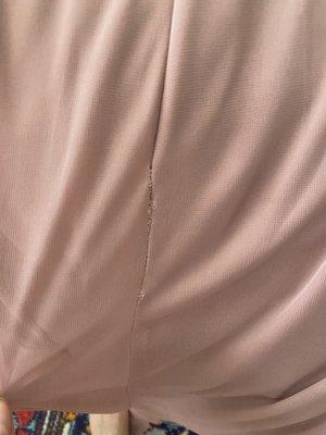 The seam on the back of the dress after alterations.