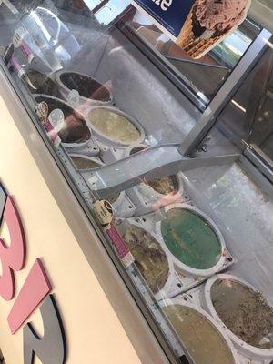 Display lopsided and dirty with old ice cream