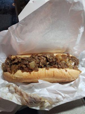 Cheesesteak wit onions and provolone. Don't worry, there's cheese, under the meat