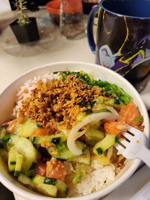 salmon mixed with onion, scallion, cucumber, pineapple, umami miso sauce, topped with seaweed salad, kani salad, and onion crisps.