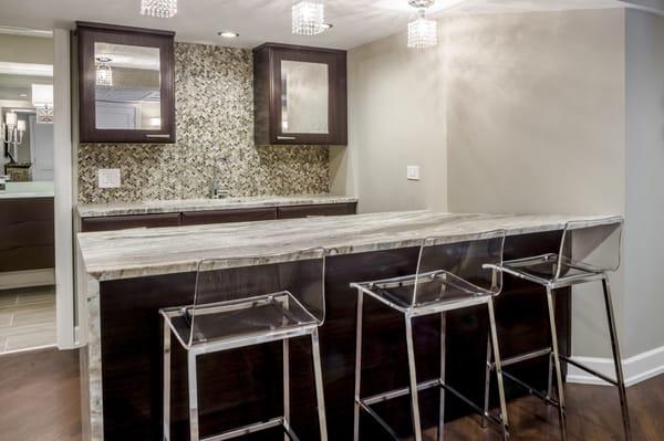 Basement bar - honed granite mosaic tile backsplash