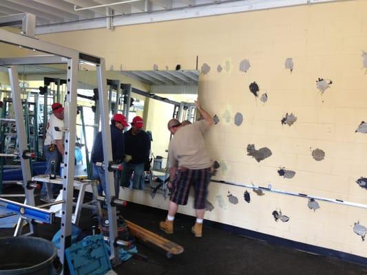 Redondo Beach glass guys at work re-installing about 350 sq ft of mirror at RJS FITNESS