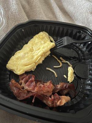 This was supposed to be a cheddar and bacon omelet with a fruit cup.