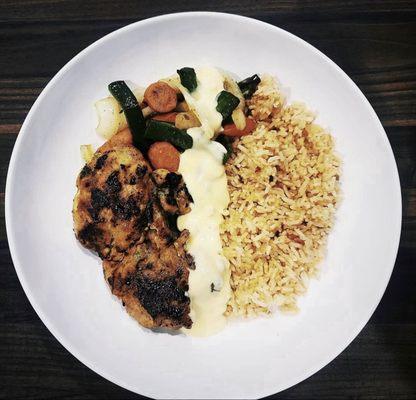 Cajun chicken with beer queso, pan fried rice, and veggies