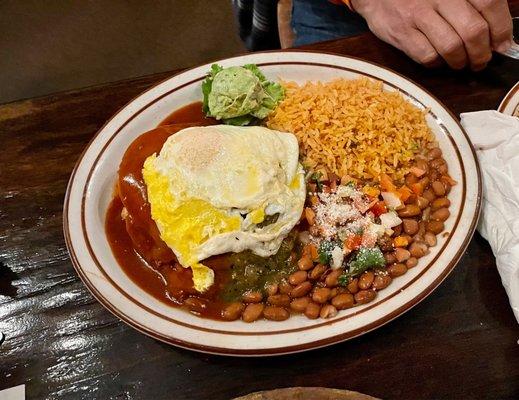 Enchiladas Sonoran. 3 types of enchiladas served with an egg.