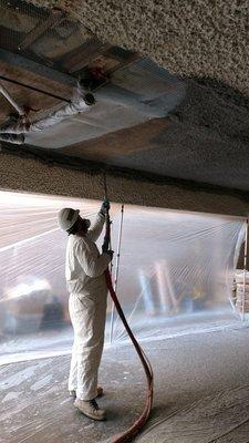 Spraying on stucco for one of our Seismic Soft Story Retrofit Projects