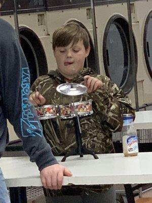 Kid playing the drums