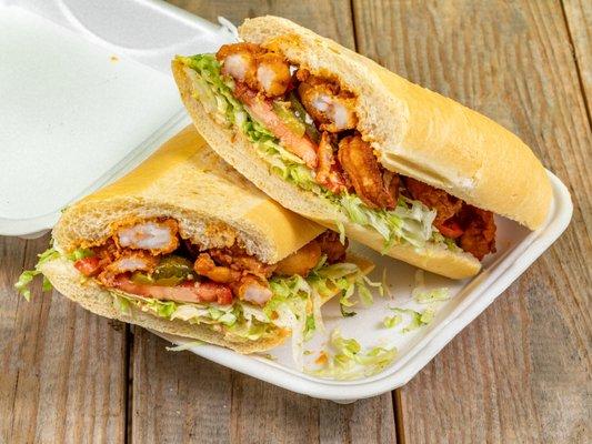 Fried Shrimp Po' Boy with lettuce, tomato, and remoulade sauce on Cuban bread