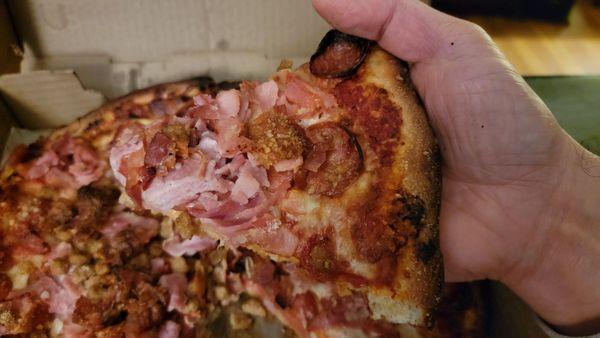 Small (12", 6 slice) Meat Lovers Pizza: Generous layer of meats on top!