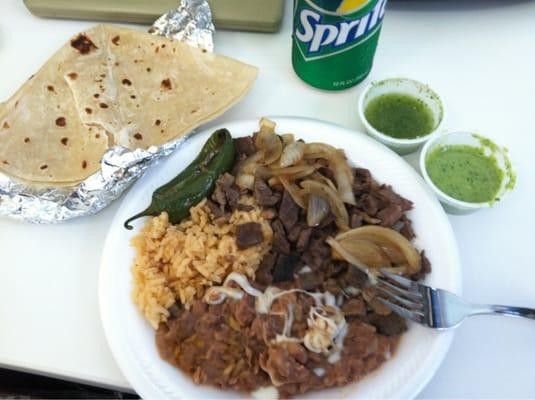 Awesome $6 lunch. The carne asada plate. Both green salsas are amazing.