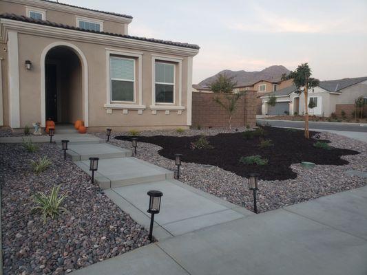 Completed front yard landscaping and walkway to front door