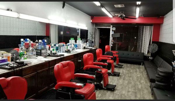 Come in and have a beer or soft drink on us while you sit on our Ferrari red chairs and get a great haircut!