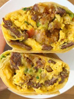 Steak Breakfast Burrito - carne asada, eggs, cheese, tater tots, avocado, pico de gallo, and scallions