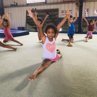 Look at this!  Our beginner class working on their splits!