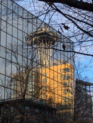 Reflection of the Space Needle on a glass building a block away from this cafe.