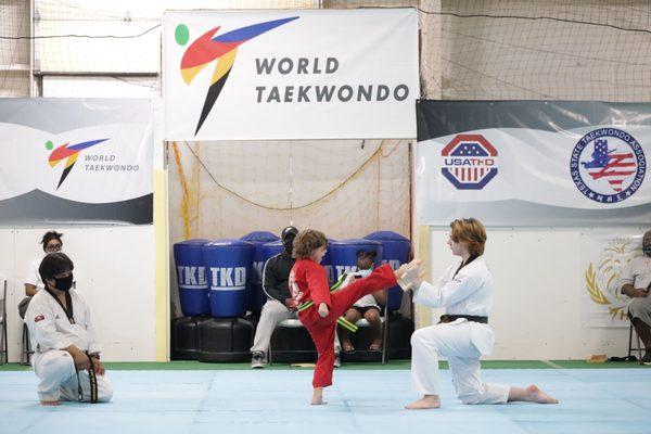 Colton Adams breaks his board with axe kick at 141st belt test