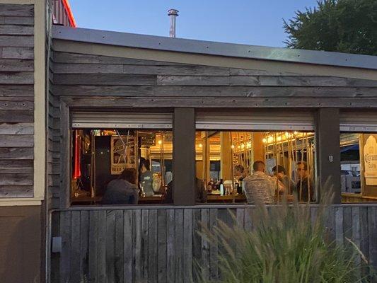 Outdoor Patio with Swings for bar seats!!