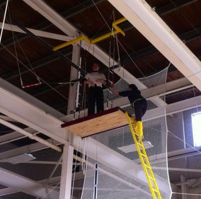 Climbing the ladder to the platform at Twin Cities Trapeze Center