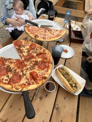 Eating pizza outside on the picnic tables