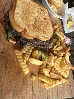 Ribeye Sandwich with fries.