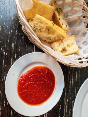 Red dipping sauce for garlic bread.