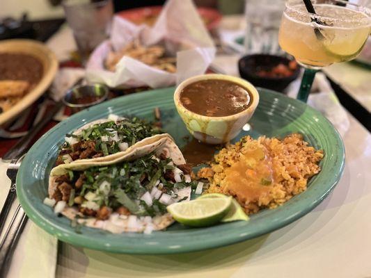 Al pastor taco plate with borracho beans and rice