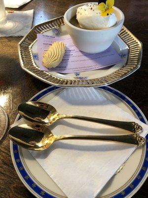 Dessert: butterscotch pot de creme served with gold flatware.