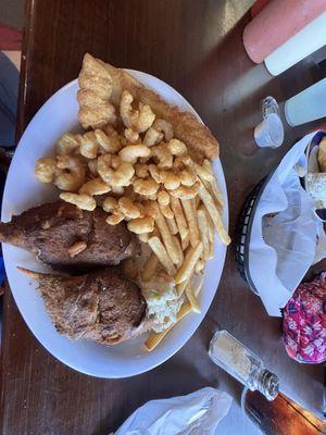 The Captains Platter complete with a basket of some of the best hush puppies I've ever eaten!!!