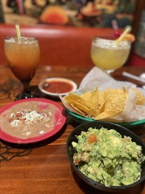 Guacamole, Beans, tortilla chips, and drinks