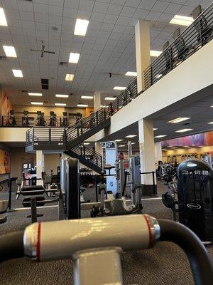 Cardio machines and fitness studio upstairs