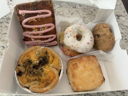 Strawberry pop tart, funfetti donut, brown butter chocolate chip cookie, mushroom and cheese quiche, plain biscuit