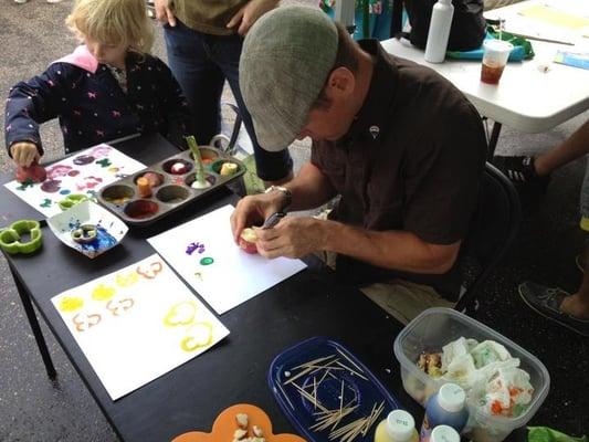 Erik Brown "Veggie Painting" with the kids at the Kingfield Farmers Market