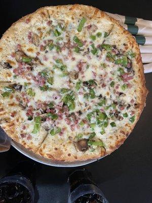 Made our own, white garlic sauce, ham, mushroom and green pepper. So good