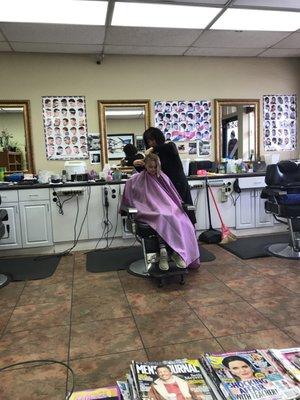 My daughter getting her haircut