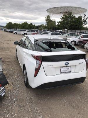 My car sitting wide open after being towed during a hail storm- my insurance company sure appreciates your great dedication