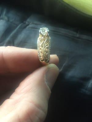 They repaired (recast and cut ) the side (gold) fillet on this ring to match the other side.