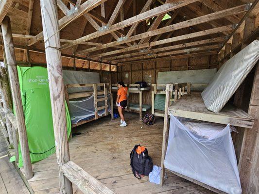 Detailed view of inside of cabin, with 8 bunks