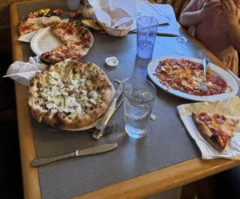 Happy face pepperoni pizza, ravioli and QUATTRO STAGIONI pizzas.