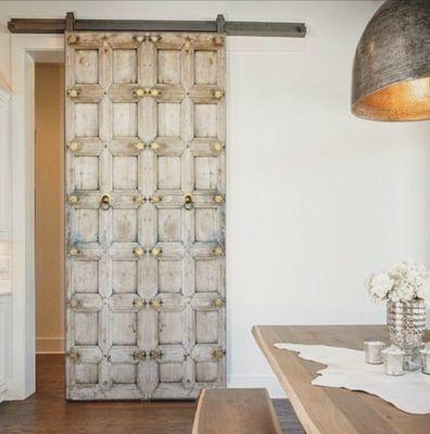 An Antique  door is added to this contemporary home renovation project, A perfect rustic modern combination