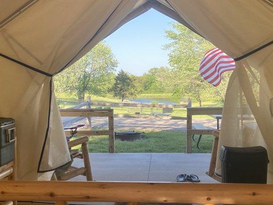 View from inside. Own porch with rocking chairs. Private fire pit and picnic table. Great view of the pond.