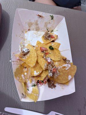 Tasty nachos, 90 seconds after they arrived, since the kids demolished these.