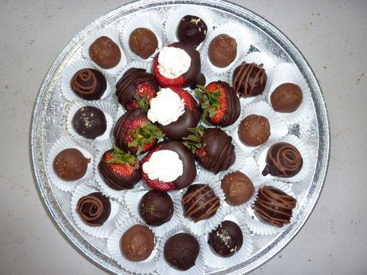 Strawberries dipped in chocolate, also stuffed with cannoli cream & truffles.