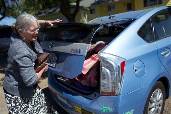 Midwive's car is full of supplies and equipment