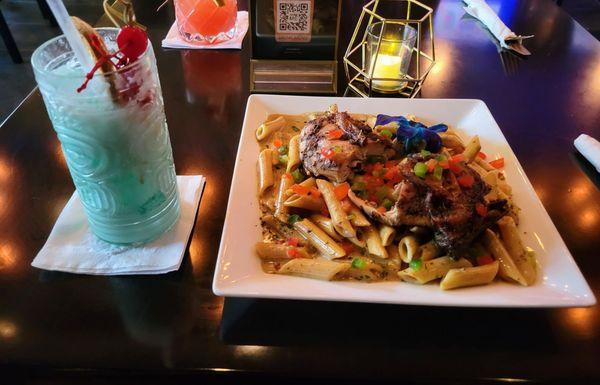 Rasta Pasta with jerk chicken. Montego Bay drink.