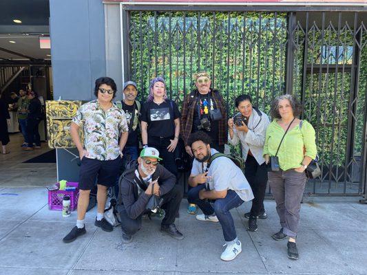 The crew from @sfinstantphotowalk taking a boss posse photo in front of the artwork of Patrick Hofmiester.