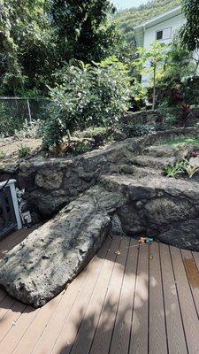 This boulder was too large to move so Takai used it as a feature--a unique bottom step in the backyard.